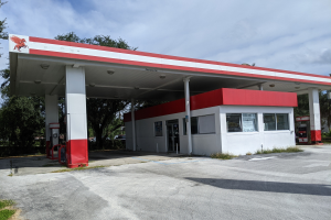 Vacant gas station and convenience store exterior photographed for documentation